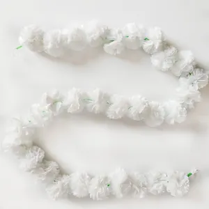 White artificial marigold garland for Indian wedding and Day of the Dead festival decor
