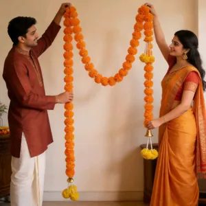 Artificial orange marigold garlands with golden bells for Diwali and Indian wedding decor