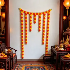 Traditional orange and yellow marigold flower garland hanging decoration for festive home settings