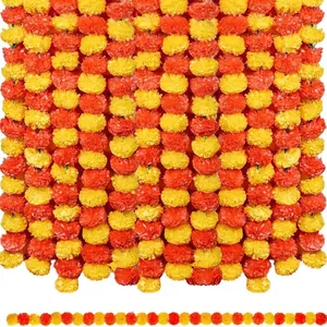 Detail view of vibrant orange and yellow marigold flower garlands for festival decoration