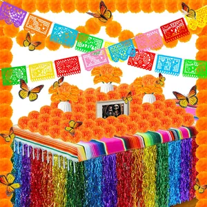Mexican Day of the Dead decoration set with marigolds, papel picado and butterflies.