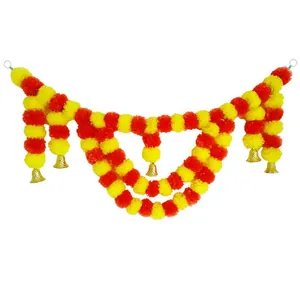 Vibrant orange and yellow marigold flower garland festive decoration with golden bells