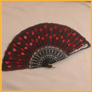 Detail view of a red and black lace folding fan with sequins for Day of the Dead cosplay.