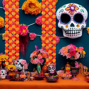 Close-up view of vibrant orange marigold garlands and colorful Day of the Dead skull decor