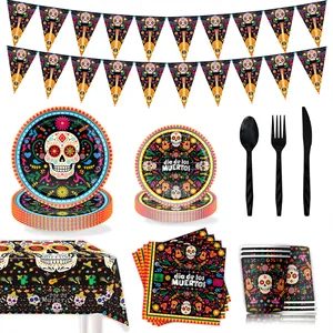 Detailed view of Mexican Day of the Dead party supplies with skull plates and napkins