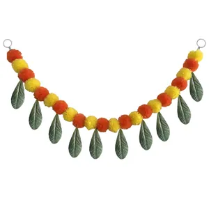 Handmade marigold and mango leaf garland for Day of the Dead and Diwali festival decor