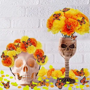 Day of the Dead decor set with marigold garlands, skull centerpiece and orange butterflies