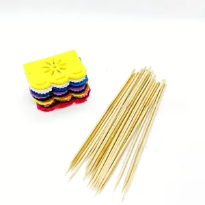 Multi-colored Day of the Dead felt cutouts with bamboo skewers for Mexican party decor