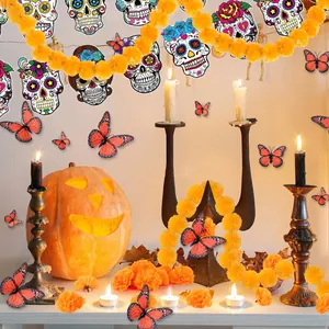 Day of the Dead decoration set with marigold garlands, butterflies, and sugar skull banner