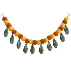 Indian style marigold pom-pom garland with green leaves for wedding festival decor