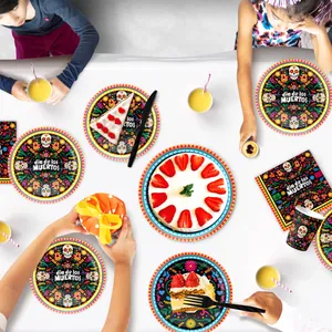 Day of the Dead themed party tableware set displayed on a festive table with snacks