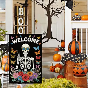 Detail of Day of the Dead garden flag with skeleton, butterflies, and Welcome text
