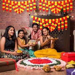 Vibrant orange and yellow artificial marigold garlands for Indian wedding and festive home decor