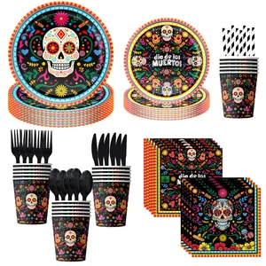 Overview of Day of the Dead party supplies including skull plates, cups and black cutlery