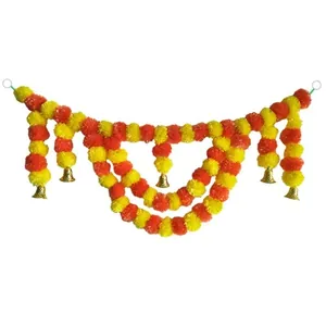 Traditional Indian wedding decoration garland with orange and yellow marigold flowers and golden bells