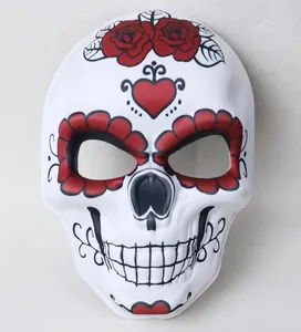 Detailed view of traditional Day of the Dead mask featuring vibrant red rose patterns