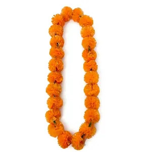 Long orange marigold flower garland for Day of the Dead celebrations and Indian wedding decor.