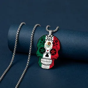 Close-up of stainless steel necklace with Mexican flag skull pendant detail