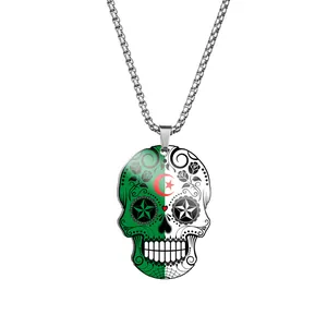 Detailed view of stainless steel skull pendant with Algerian flag print and floral pattern