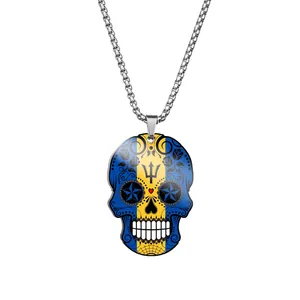 Close-up of stainless steel sugar skull pendant featuring Barbados flag graphics