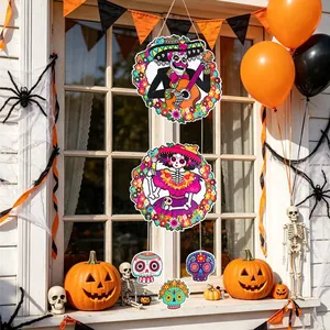 Vibrant Dia de los Muertos hanging decorations featuring colorful sugar skull designs