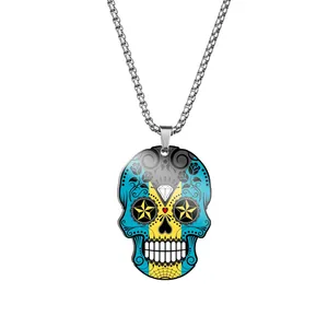 Detailed close-up of a stainless steel skull pendant with colorful Day of the Dead print