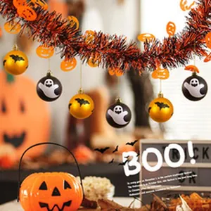 Close-up of Halloween garland with ghost and bat ornaments for festive indoor decoration