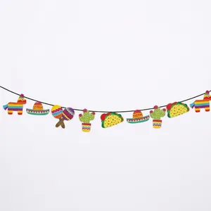 Close-up detail of Mexican themed party garland with pinata and cactus designs