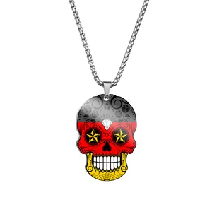 Close-up of German flag themed sugar skull pendant on stainless steel chain