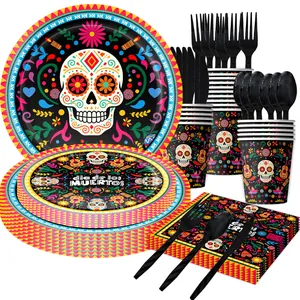 Dia de los Muertos party tableware set with vibrant sugar skull designs on black paper