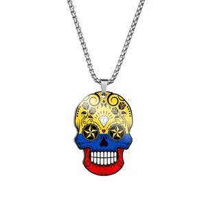 Detailed view of the stainless steel sugar skull necklace with vibrant flag color print