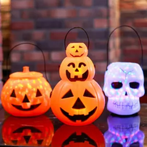Glowing Halloween pumpkin and skull lanterns for festive outdoor patio decoration