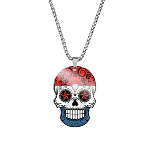 Detail of stainless steel sugar skull necklace with colorful flag pattern print