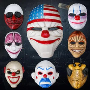 Selection of various scary clown and Payday-style masks for Halloween decoration.