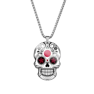 Macro detail view of a stainless steel Day of the Dead sugar skull pendant necklace.