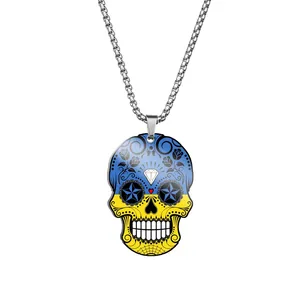Detailed macro view of a skull pendant with blue and yellow flag colors on a chain