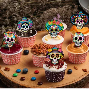 Detailed view of Day of the Dead cupcake toppers with colorful sugar skull designs