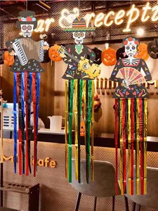Day of the Dead themed hanging skeleton decorations with colorful metallic streamers