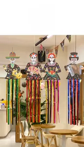 Detail view of four Day of the Dead skeleton hanging decors with metallic streamers