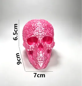 Detailed view of a pink 3D printed floral skull ornament showing dimensions 9x7cm