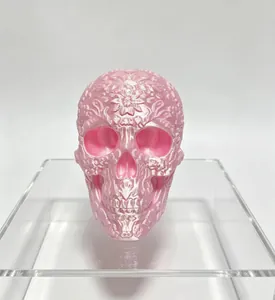 Detailed view of pink 3D printed floral engraved skull decor for Day of the Dead