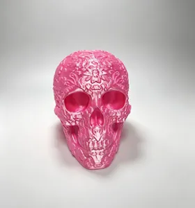 Intricate 3D printed pink floral skull ornament featuring Mexican Day of the Dead motif