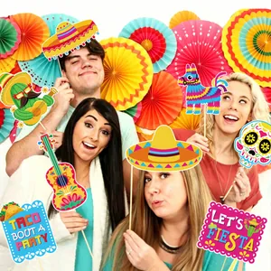 Colorful Mexican Fiesta photo booth props set used by group of friends at a party