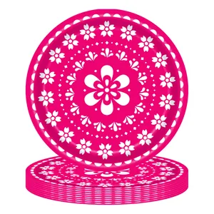 Detailed stack of pink Day of the Dead paper plates with white floral patterns