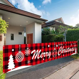 Long red buffalo plaid Merry Christmas banner hanging in a residential driveway scene