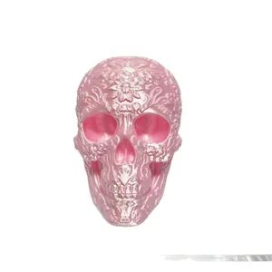 3D printed pink skull ornament with intricate floral pattern Day of the Dead decor