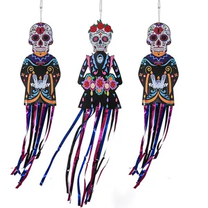 Sugar skull hanging decorations with colorful streamers for Halloween and Day of the Dead