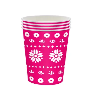 Stack of festive pink Day of the Dead disposable paper cups with white floral pattern detail