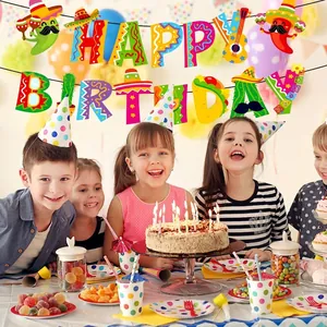 Colorful Mexican fiesta Happy Birthday banner hanging above a group of children at a party