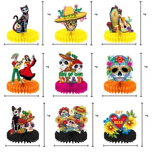 Colorful Day of the Dead honeycomb centerpieces for Mexican themed party table decor.